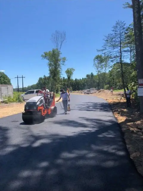 Roller compacting a new road