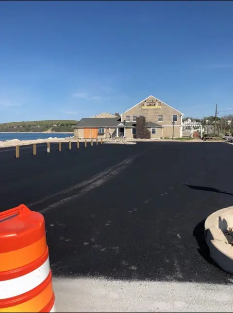 Fresh parking lot with traffic cone