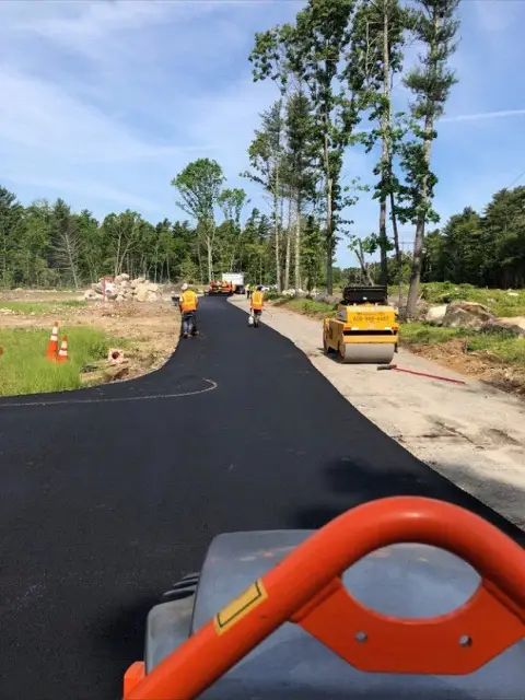 New paved lane with roller in foreground